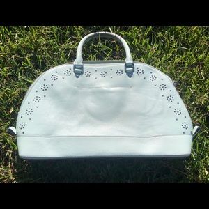 Mint green COACH bag with silver accents